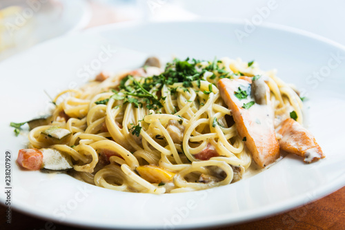 tasty pasta with salmon on a the table