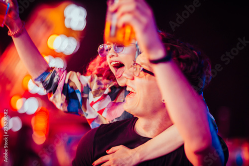 Young couple having fun on music festival