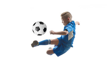 Young boy with soccer ball doing flying kick, isolated on white. football soccer players in motion on studio background. Fit jumping boy in action, jump, movement at game.