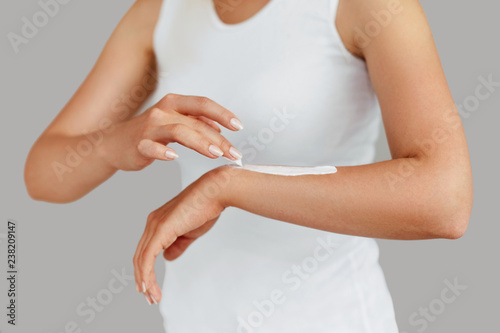 Wallpaper Mural Closeup of female hands applying hand cream.Hand Skin Care Torontodigital.ca