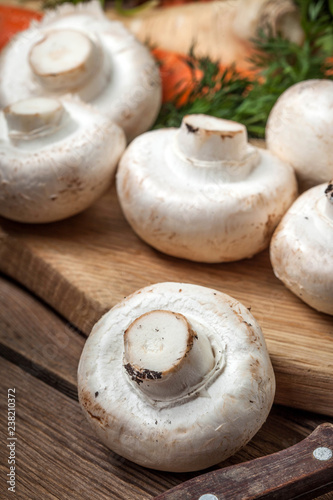 Fresh mushrooms on cutting board.