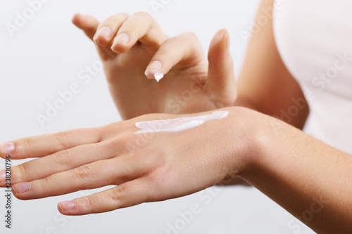 Closeup of female hands applying hand cream.Hand Skin Care