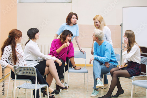 Group of women in the office at the seminar together discuss topics of interest