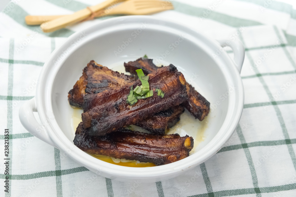 Pieces of fried pork rib on white dish Pieces of fried pork rib on white dish