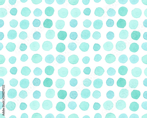Seamless pattern with arranged rows of turquoise blue polka dots painted in watercolor on white isolated background