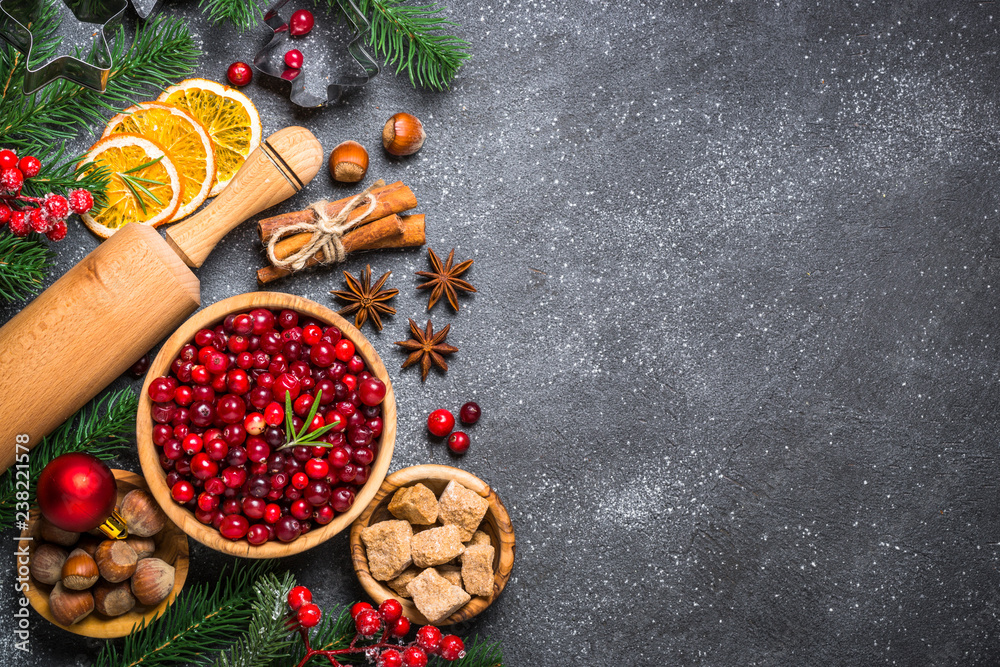 Christmas food baking background top view on black background.