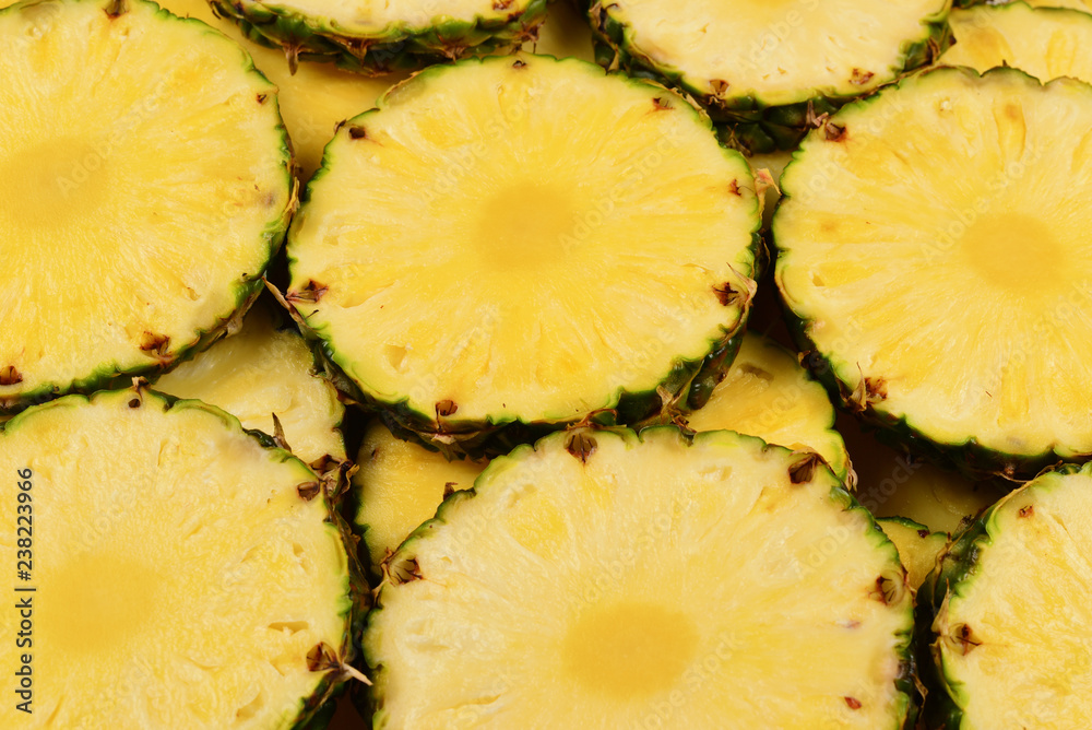 Pineapple juicy yellow slices background. Top view. Pineapple juicy yellow slices background. Top view.