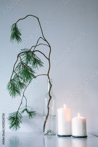 Scandinavian Christmas decor. pine branches and candles