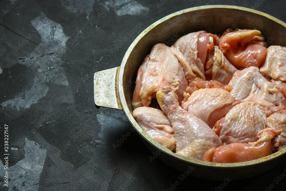 chicken crude pieces - raw meat (dark background). top view. to copy space chicken crude pieces - raw meat (dark background). top view. to copy space