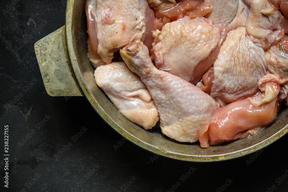 chicken crude pieces - raw meat (dark background). top view. to copy space chicken crude pieces - raw meat (dark background). top view. to copy space