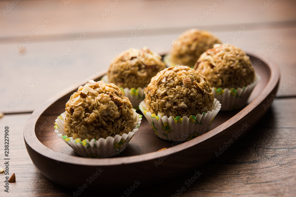 Oats laddu or Ladoo also known as Protein Energy balls. served in a plate or bowl. selective focus Oats laddu or Ladoo also known as Protein Energy balls. served in a plate or bowl. selective focus
