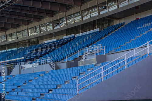 empty stadium tribune blue seats rows