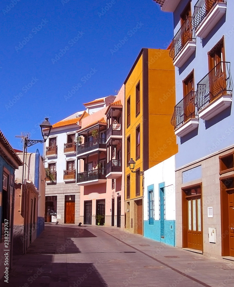 Beautiful colorful buildings in a narrow street in the old town of Puerto de la Cruz, one of the most popular tourist cities in Tenerife
