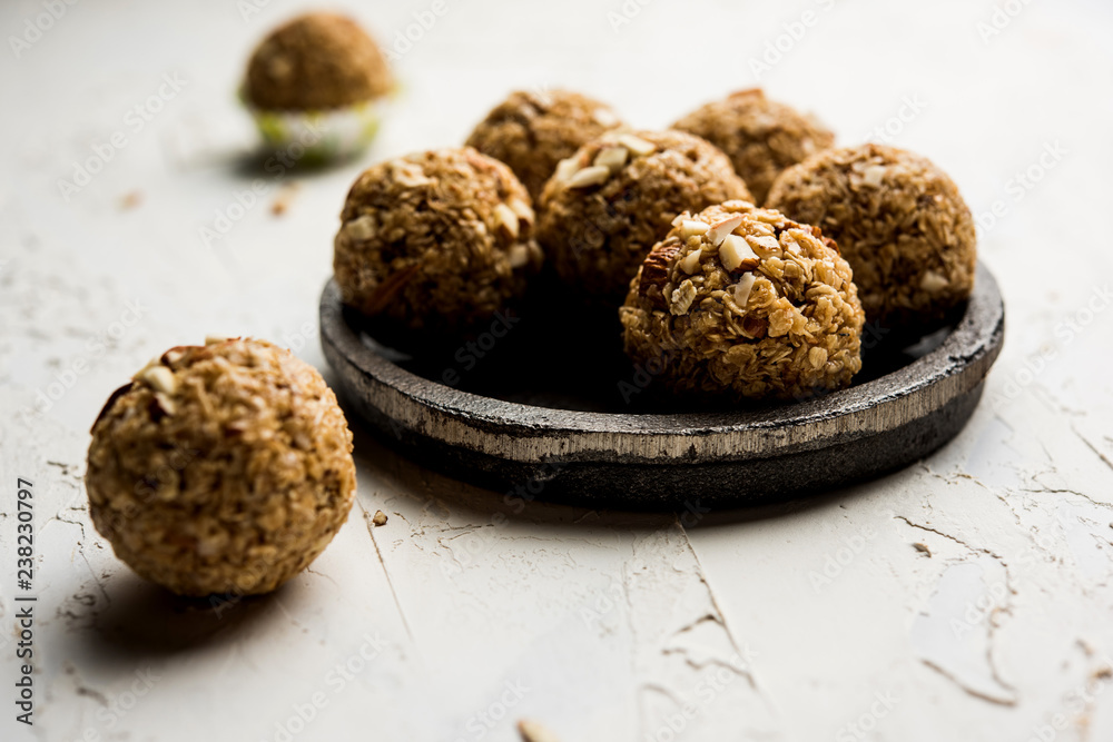 Oats laddu or Ladoo also known as Protein Energy balls. served in a plate or bowl. selective focus