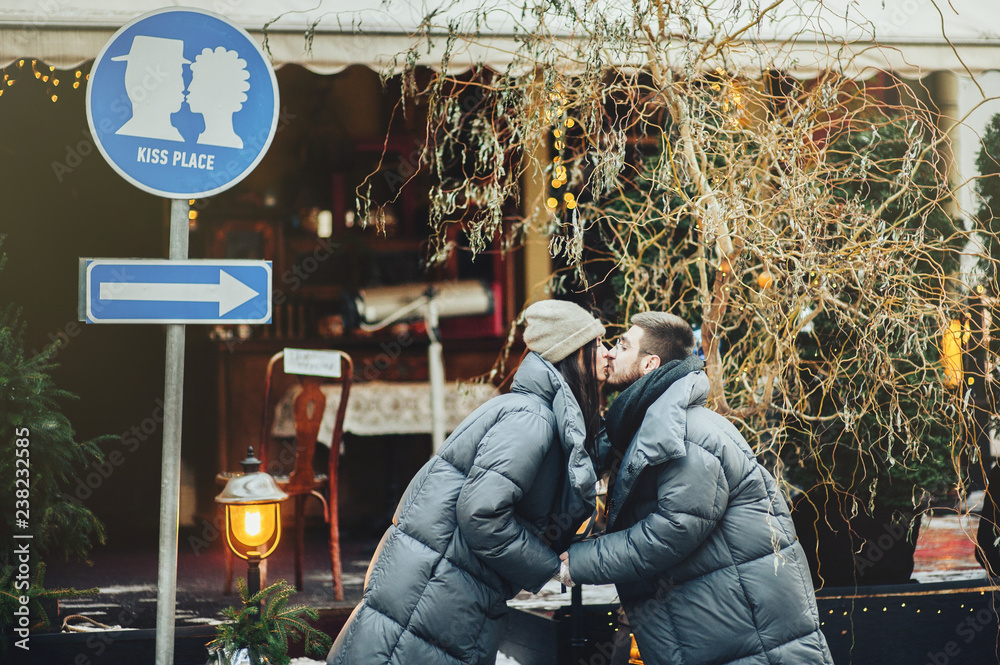 Obraz premium Young romantic couple is having fun outdoors in winter before Ch