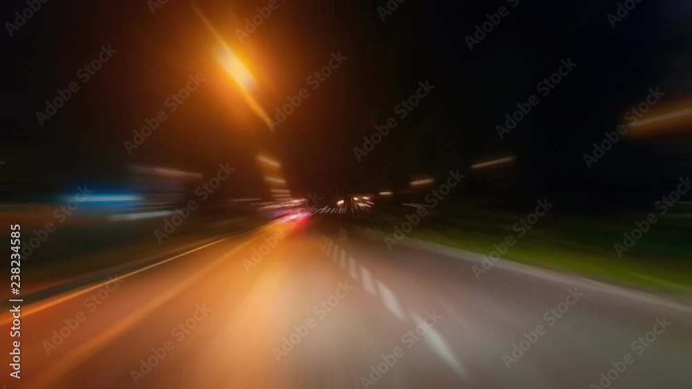 Time-Lapse night traffic with futuristic motion blur & zoom effects. On the road or streets, shoot from inside a moving car. 
