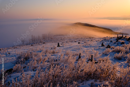 rock in in the rays of the setting sun on the island of Olkhon  lake Baikal