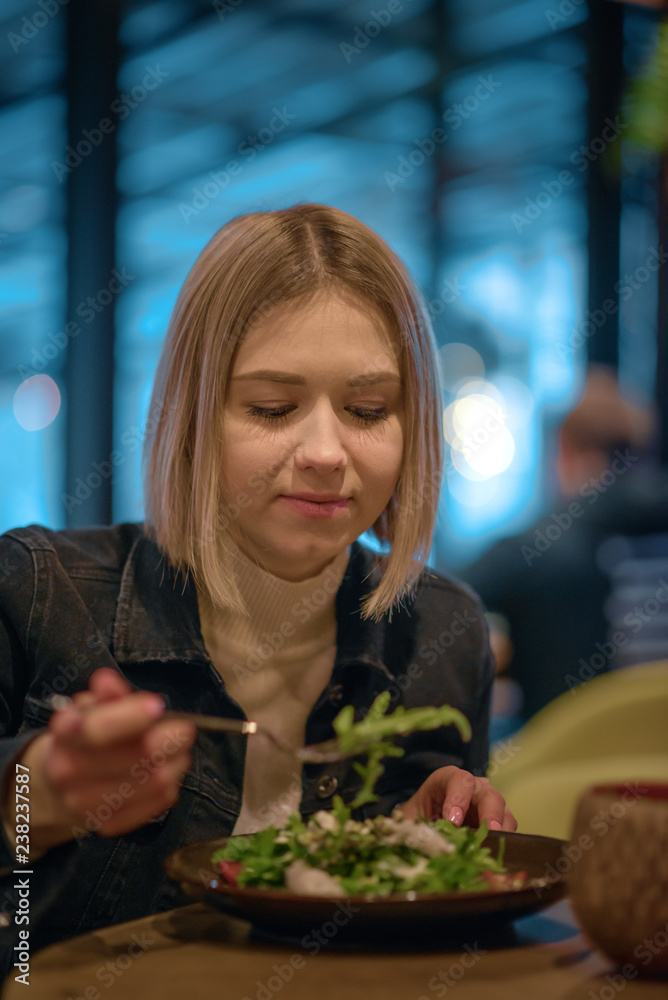 Woman eating lunch at a restaurant