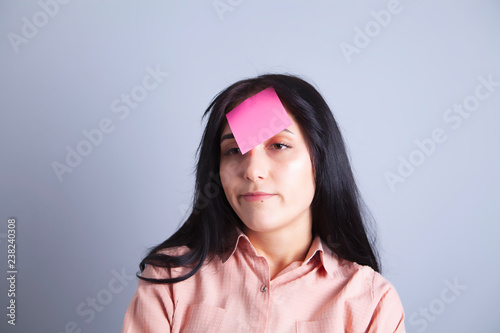 girl forehead glued paper