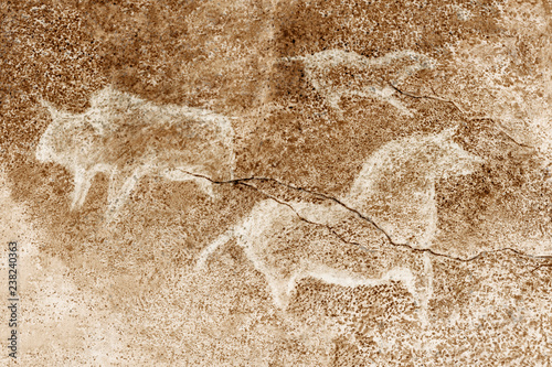 image of ancient mammal animals on the cave wall. history of antiquities, archeology.