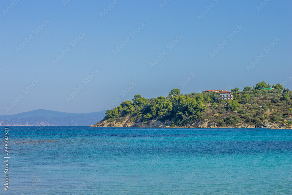 Aegean sea bay waterfront shore tropic landscape with view to island, summer tourist vacation holidays landscape, copy space