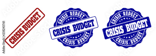CRISIS BUDGET scratched stamp seals in red and blue colors. Vector CRISIS BUDGET watermarks with grunge texture. Graphic elements are rounded rectangles, rosettes, circles and text labels.