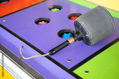 фотографія Padded mallet on a carnival pop up whacking game