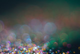 Abstraction colorful bokeh on a dark background. Defocused.