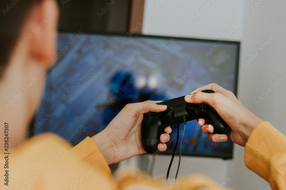 hand with the joystick playing video games
