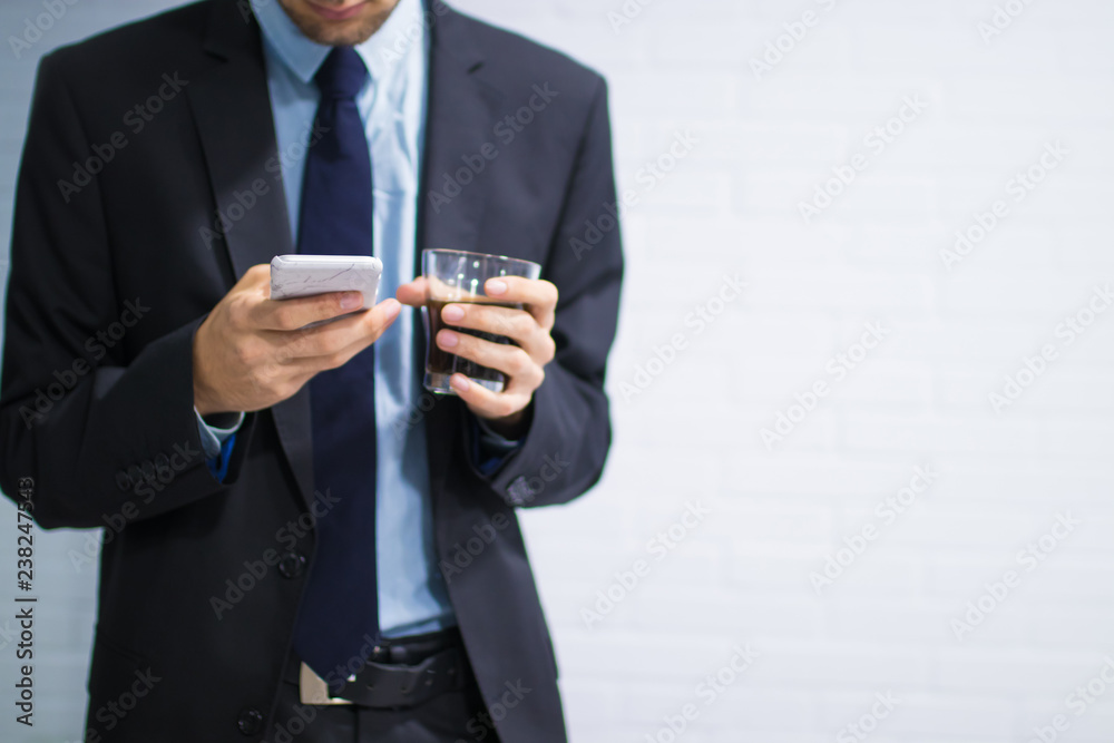business man with mobile phone and coffee mug