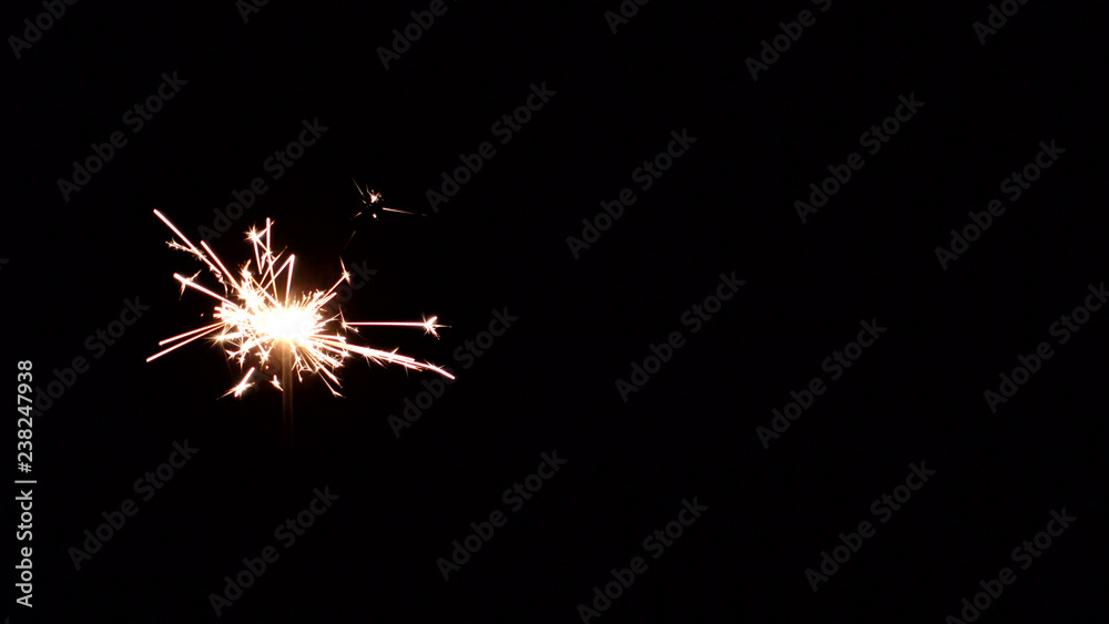 Fototapeta premium Christmas eve. Dark background. Bengal lights, sparklers.