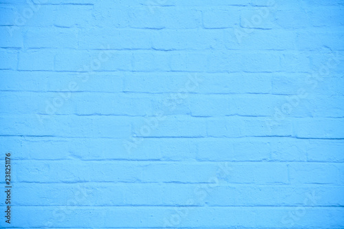 The texture of brick wall colored in blue  background