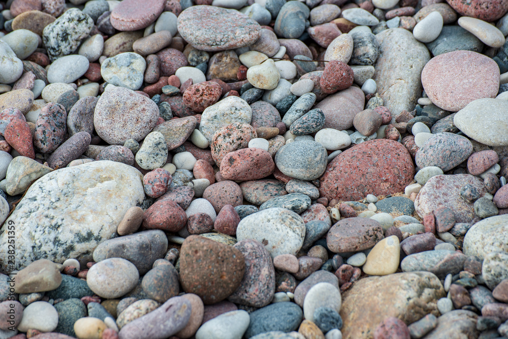 rock covered beach in countryside in Latvia, large rocks in water rock covered beach in countryside in Latvia, large rocks in water
