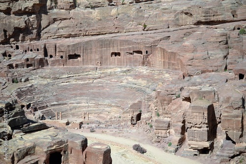 Ancient theater in Petra, Jordan - ancient Nabatean city in red natural rock and with local bedouins, UNESCO photo