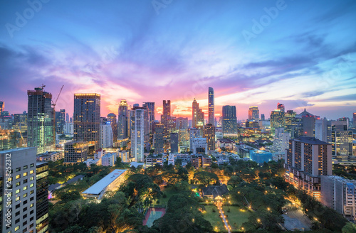 Aerial view of Bangkok modern office buildings, condominium in Bangkok city downtown with sunset sky , Bangkok , Thailand © naruecha