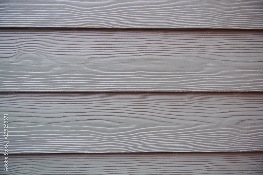 The texture of a wooden wall with horizontal stripes of grey or silver boards, background The texture of a wooden wall with horizontal stripes of grey or silver boards, background