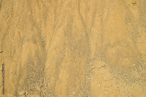 The texture of a heap of sand in a career  background