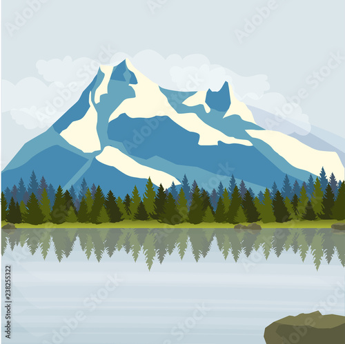 Landscape. Snowy mountains, pine forest and a large lake