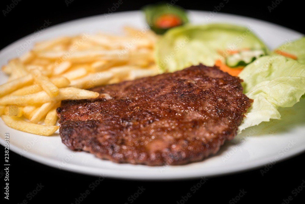 hamburger with french fries isolated on plate. hamburger with french fries isolated on plate.