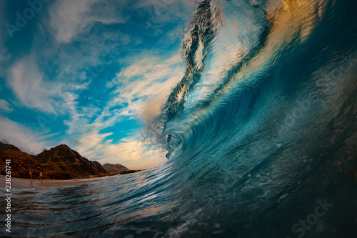 Photos Giant surfing wave barreled at sunset ocean in Hawaii