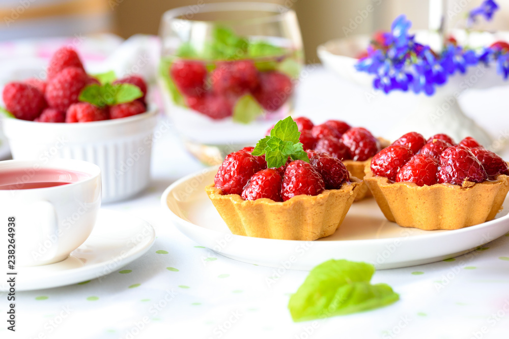 Homemade tartlets with raspberries fruits Homemade tartlets with raspberries fruits