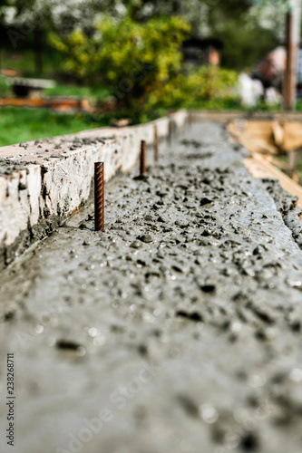 Wet cement to the civil building foundation. The process of forming house concrete slab at the construction site. Concrete texture