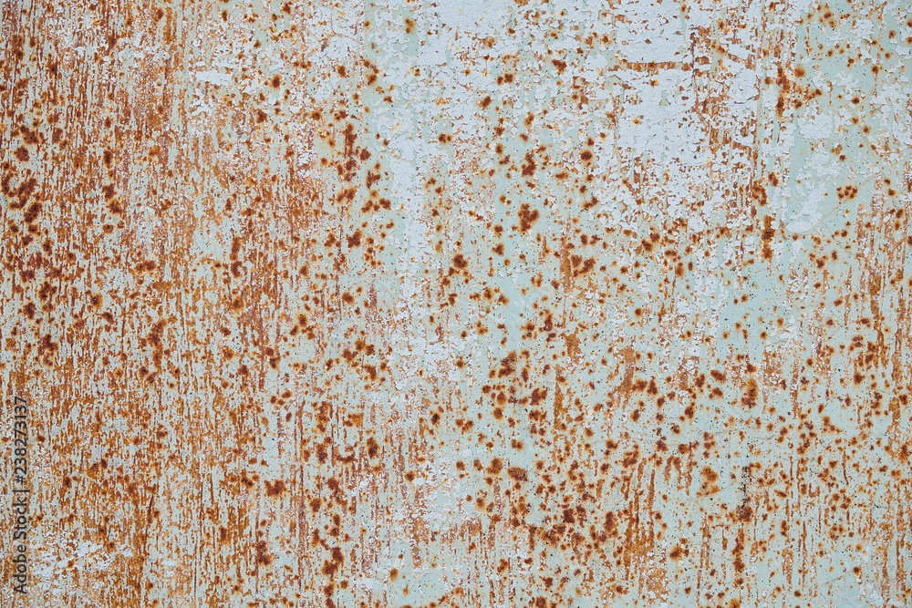 The texture of an old colored wall with small points of rust, background