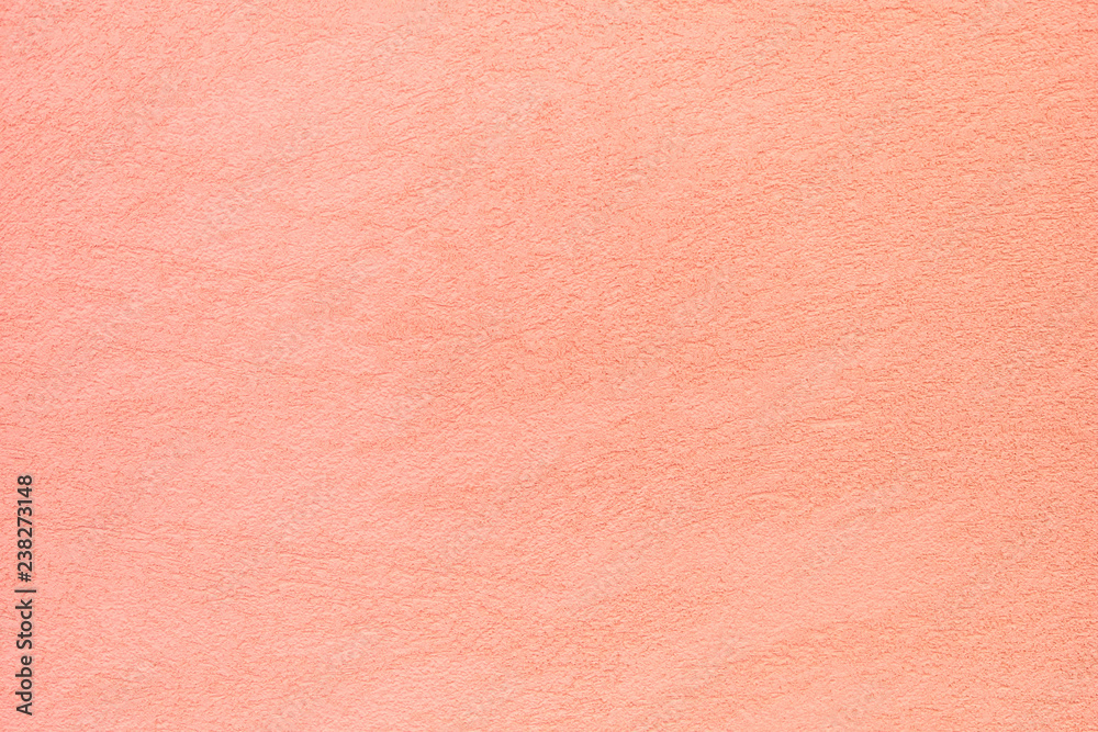 The texture of plastered peach blossom or coral wall, background The texture of plastered peach blossom or coral wall, background