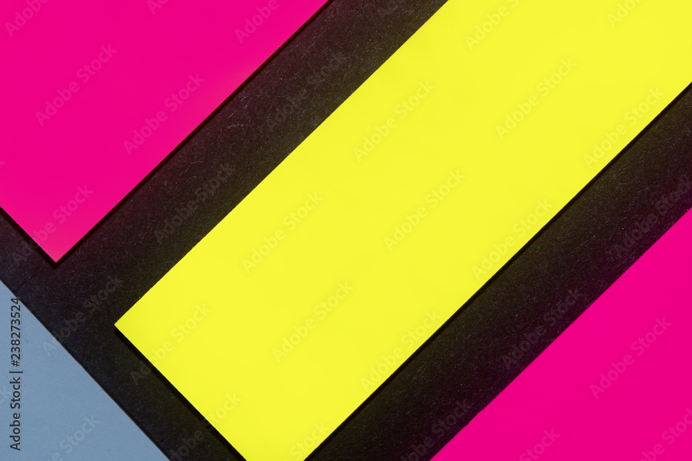 Blue, yellow and purple hue colorful office stickers on black paper. Office noteparer as reminder. Isolated on black paper.