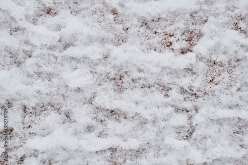 The texture of melting snow, background, close-up