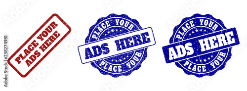 PLACE YOUR ADS HERE grunge stamp seals in red and blue colors. Vector PLACE YOUR ADS HERE labels with grunge style. Graphic elements are rounded rectangles, rosettes, circles and text labels.