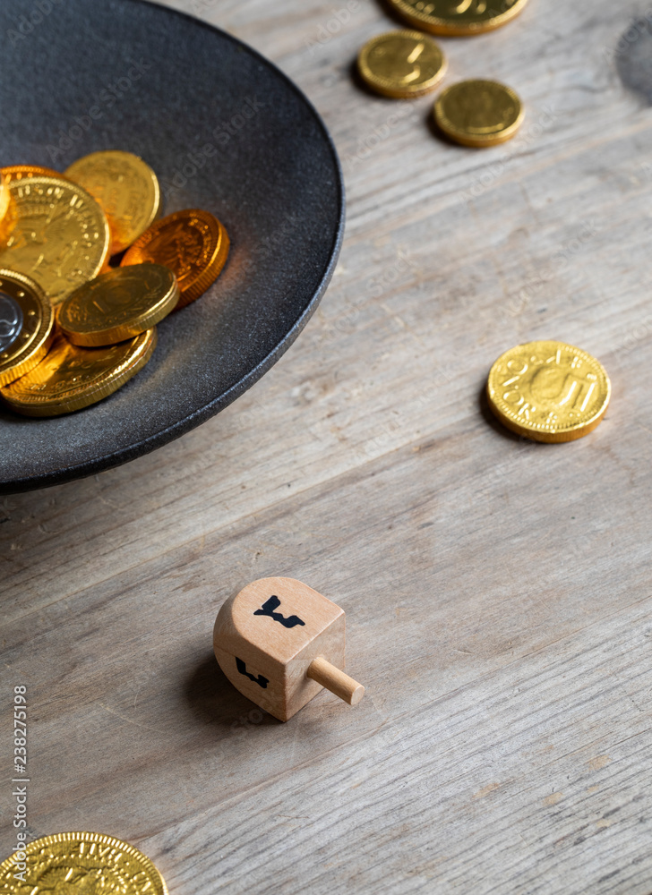 Dreidel game played with chocolate geltwood Dreidel game played with chocolate geltwood