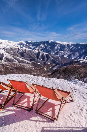 chairs on mountain top. skiing © arizanko