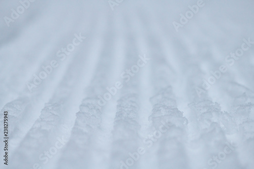 Close-up stripes of snow texture after snow machine